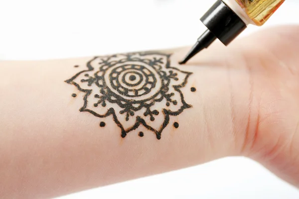 Henna ornaments on girl's hand — Stock Photo, Image