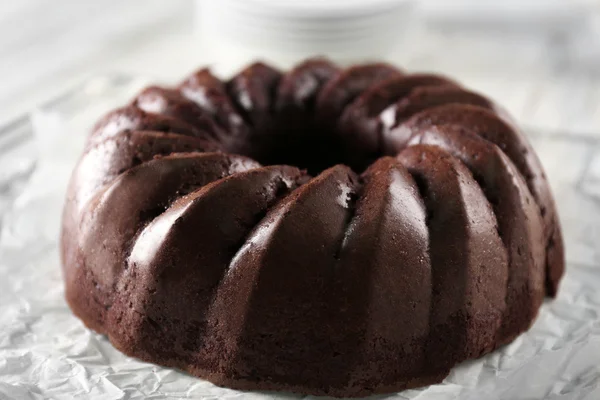 Chocolate cake on paper — Stock Photo, Image