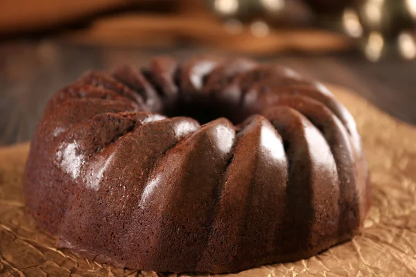 Chocolate cake on craft paper — Stock Photo, Image