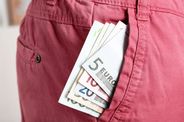 Dinero en el bolsillo rosa — Foto de Stock