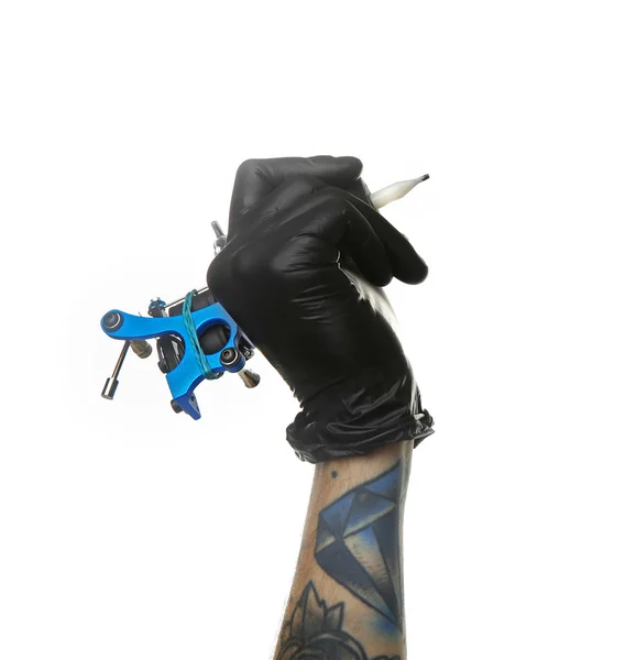 Man's hand holding tattoo machine — Stock Photo, Image