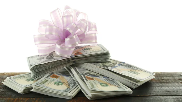 Pile of dollars with bow — Stock Photo, Image