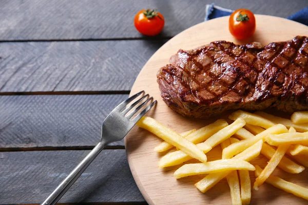 Grilled steak with french fries — Stock Photo, Image