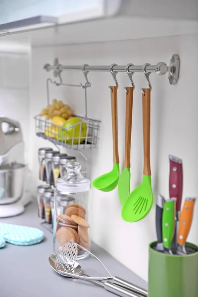 Set of cutlery hanging on wall — Stock Photo, Image