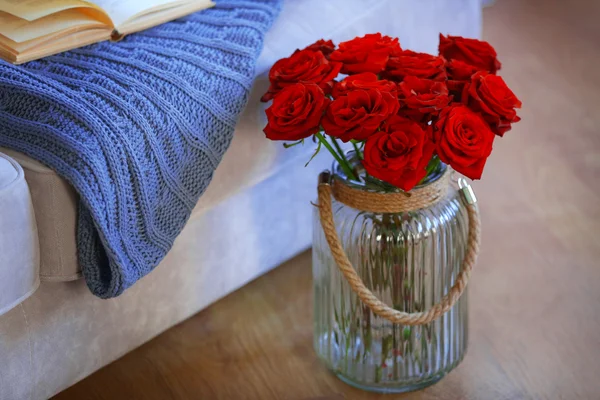 Glass jar of red roses — Stock Photo, Image