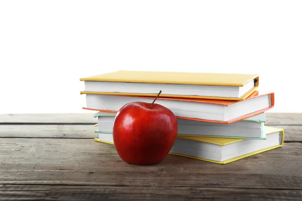 Pocos libros con manzana roja — Foto de Stock