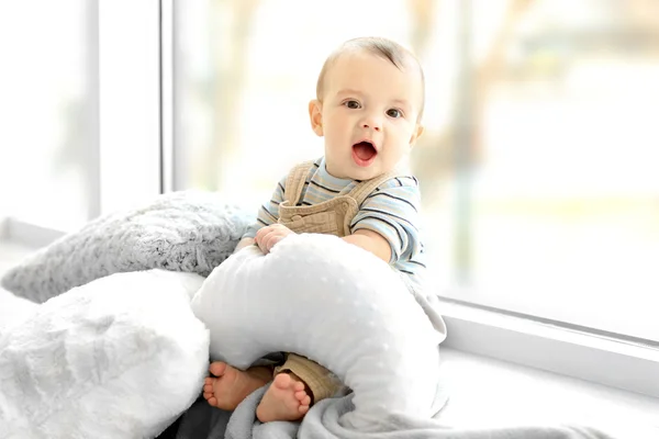 Little baby boy with pillows — Stock Photo, Image