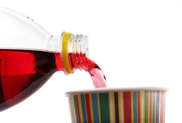 Pouring cherry soda into glass — Stock Photo, Image