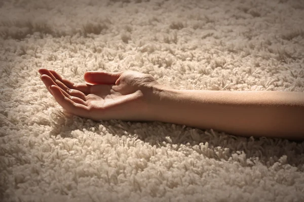 Female hand on carpet — Stock Photo, Image