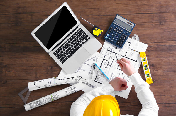 Architect sketching construction project 