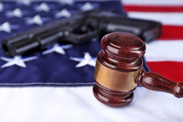 Gun and gavel on USA flag