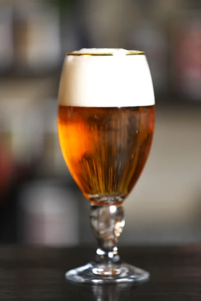 Glass of beer in a bar, — Stock Photo, Image