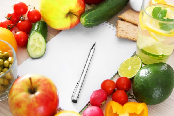 Notebook and fresh healthy products — Stock Photo, Image