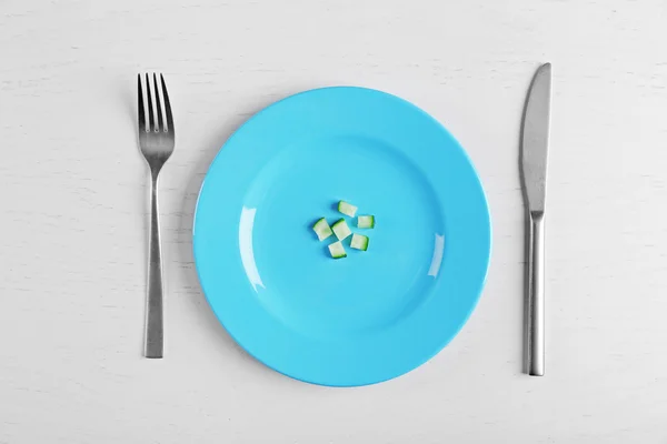 Pieces of cucumber in a blue plate — Stock Photo, Image