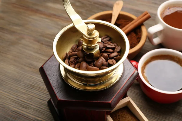 Coffee mill with roasted beans — Stock Photo, Image