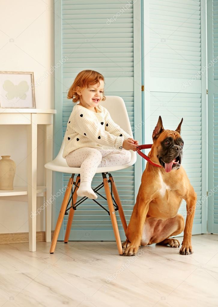 Little cute girl and boxer dog Stock Photo by ©belchonock 108387146