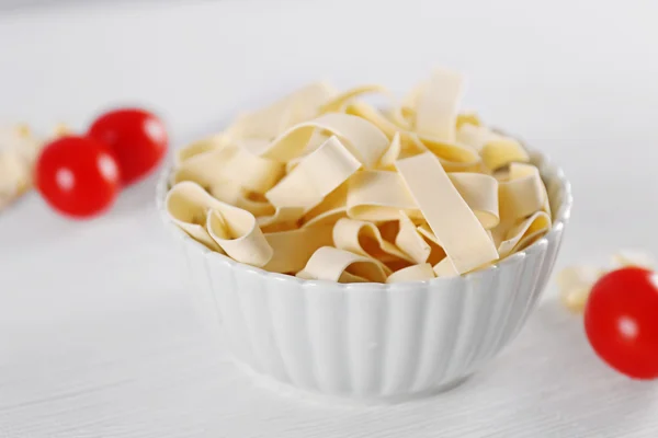 Bowl of uncooked pasta — Stock Photo, Image