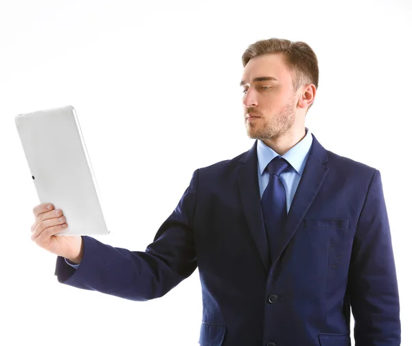 Young man in suit using tablet — Stock Photo, Image