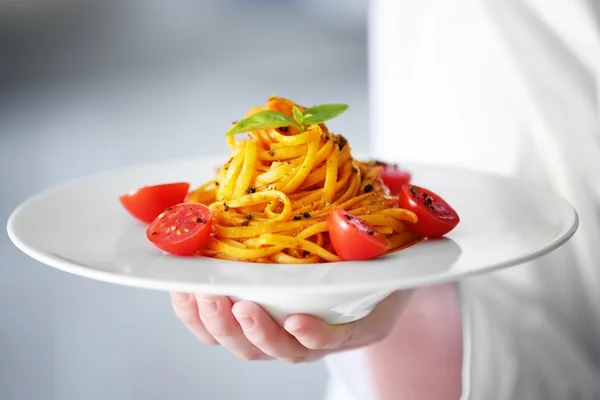 Hand holding  cold pasta salad — Stock Photo, Image
