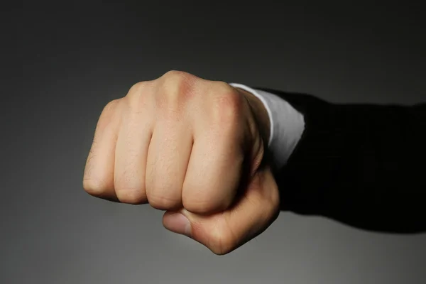Male fist on grey — Stock Photo, Image