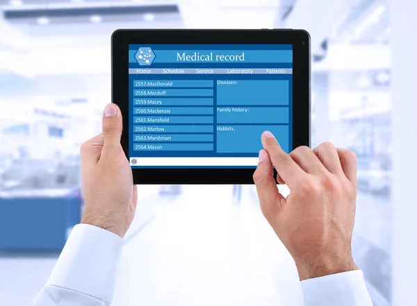 Medical tablet in doctor hands — Stock Photo, Image