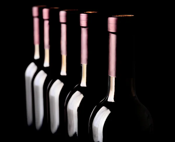 Wine bottles in a row — Stock Photo, Image