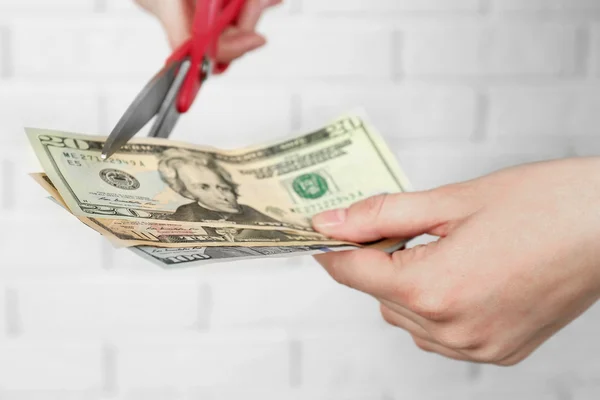 Scissors cutting money — Stock Photo, Image