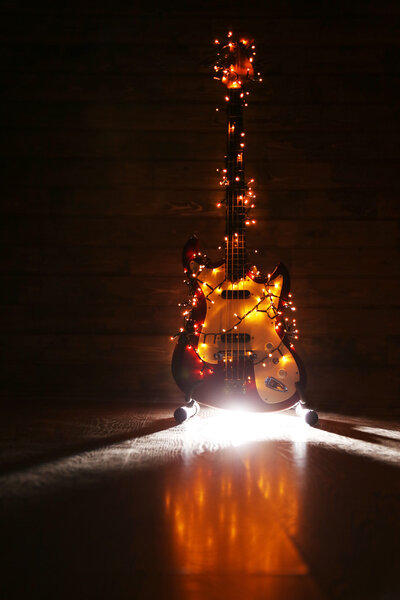 Electric guitar with lighted garland 