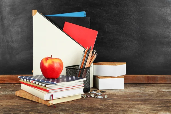 School supplies on old wooden table — Stock Photo, Image