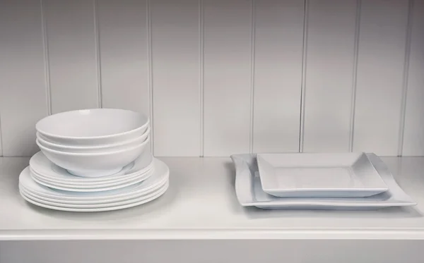 Dishes in cupboard in the kitchen