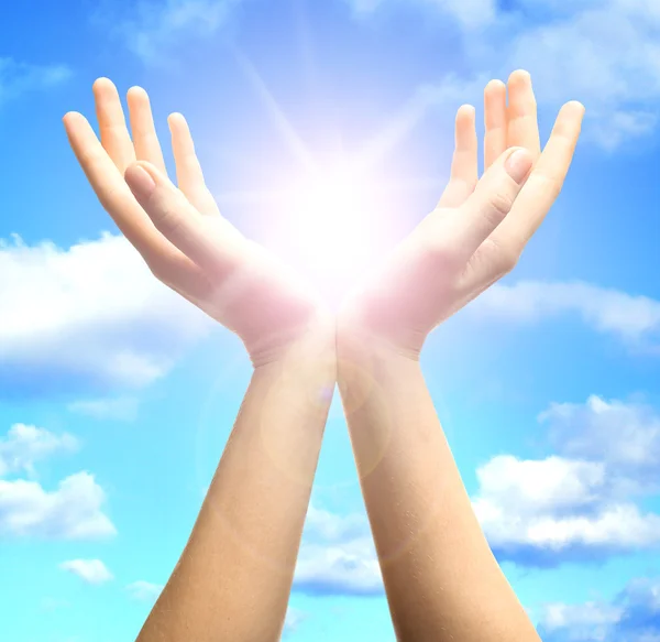 Female hands with sun — Stock Photo, Image