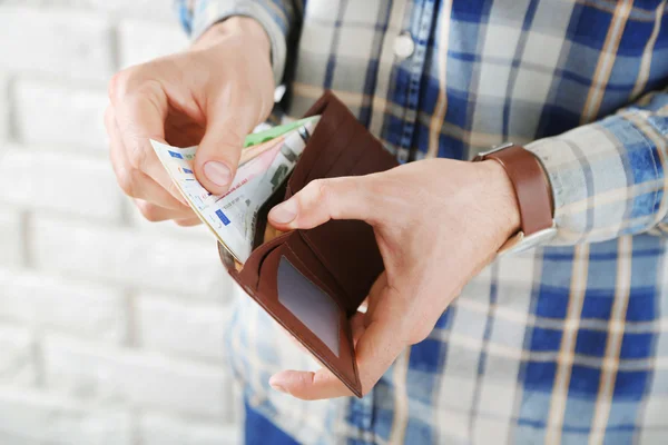 Male hands holding leather wallet — Stock Photo, Image