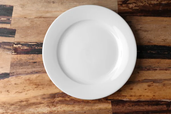 Empty plate on wooden — Stock Photo, Image