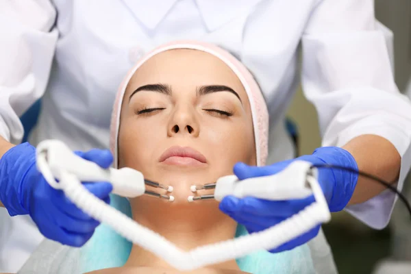 Young woman having face procedures — Stock Photo, Image