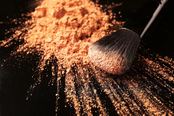 Makeup brush with powder