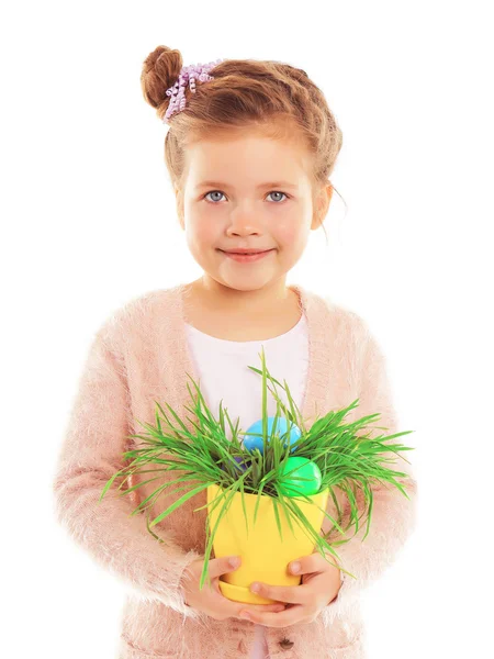 Little girl sitting with Easter eggs — Stock Photo, Image