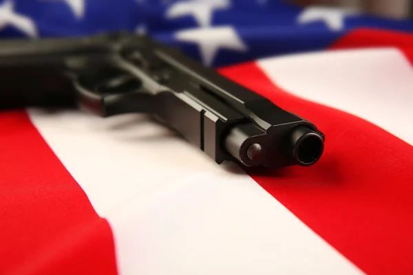 Gun on USA flag — Stock Photo, Image