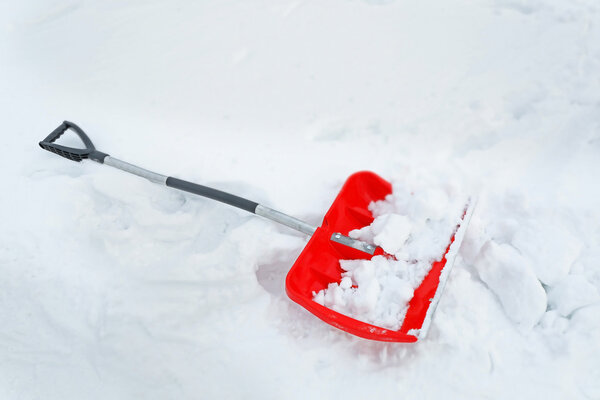 Red shovel for snow