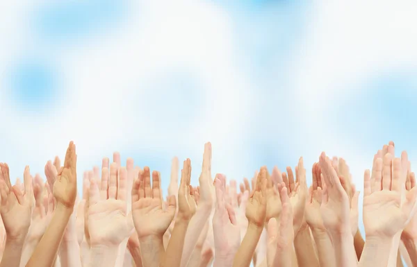 Crowd raising hands — Stock Photo, Image