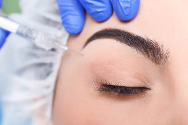 Woman receiving plastic surgery injection — Stock Photo, Image