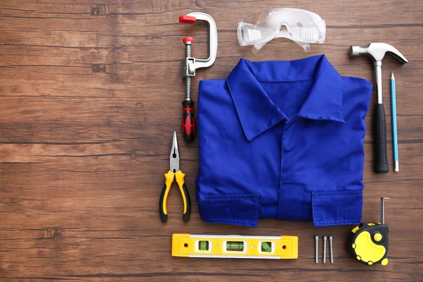 Uniform and construction tools — Stock Photo, Image