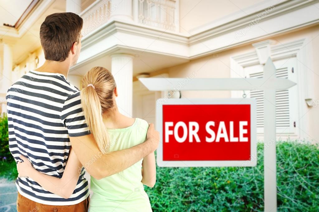 couple looking at dream house  