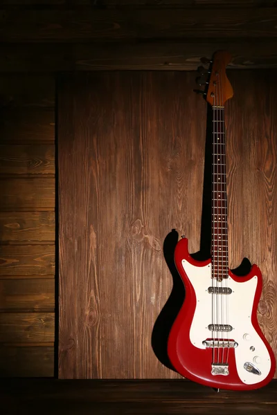 Electric guitar on wooden background — Stock Photo, Image