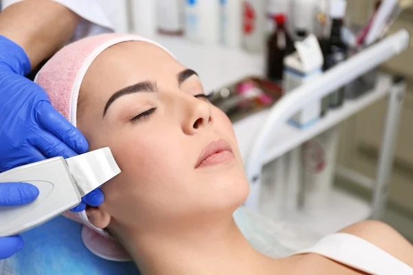 Young woman having face procedures — Stock Photo, Image