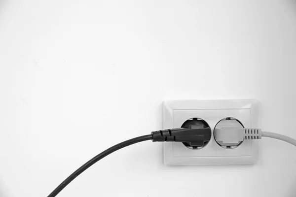 Electric plug in socket — Stock Photo, Image