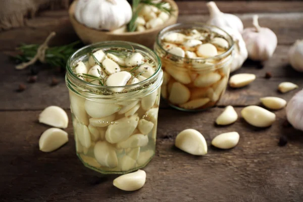 Garlic with spices on table — Stock Photo, Image