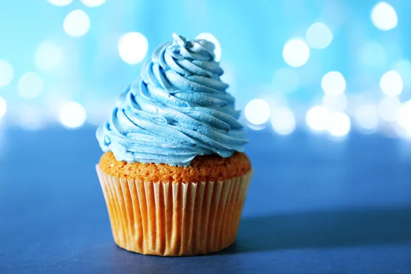 Cupcake with blue cream icing — Stock Photo, Image