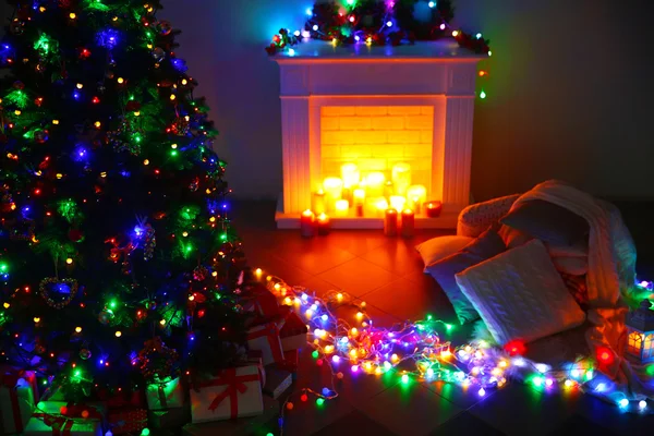 Christmas tree near fireplace — Stock Photo, Image