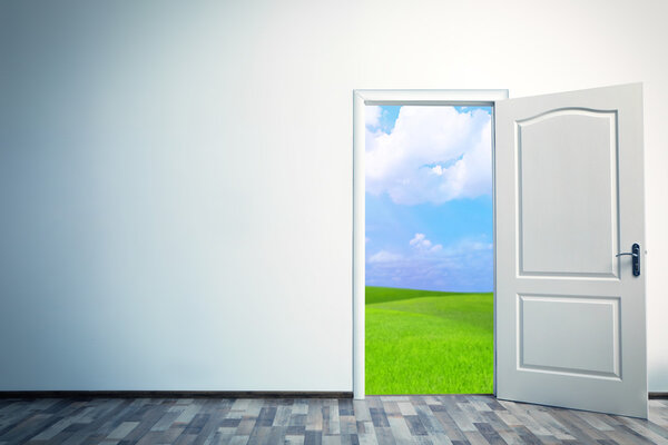 Open door leading to green field