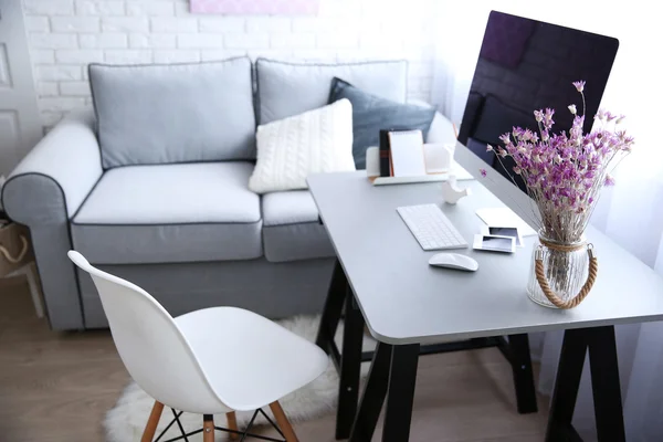 Modern interior with flowers and computer — Stock Photo, Image